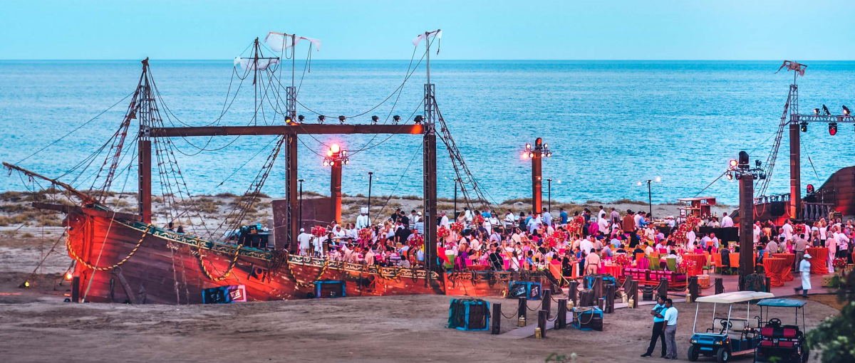 custom-built pirate ship on ocean shore